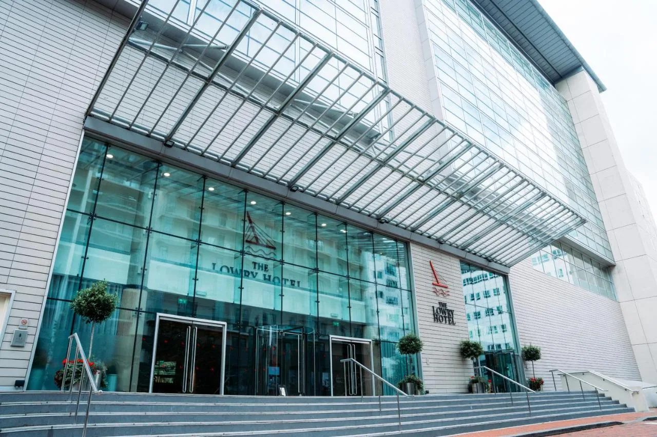 a large glass building with stairs in front of it at The Lowry Hotel Manchester in Manchester